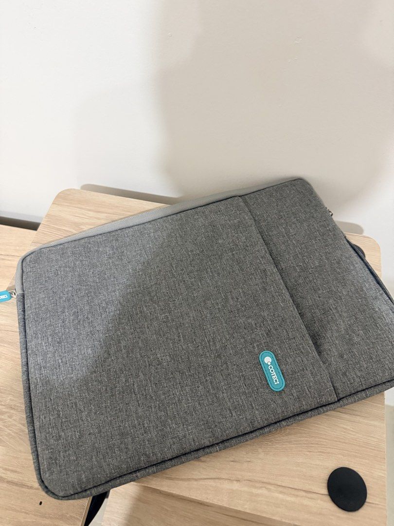 COTECT Laptop Bag (Category: Laptop Bags & Sleeves) located in Cebu City. Submitted by dr_marsh (Listing ID 1434213962, Image 2). Description: Never been used Bought at 1499 Protect your laptop in style with this gray COTECT Bag. Can fit macbook 13”. Features a secure zipper closure, front pocket, and soft interior lining. Sleek design for everyday use..