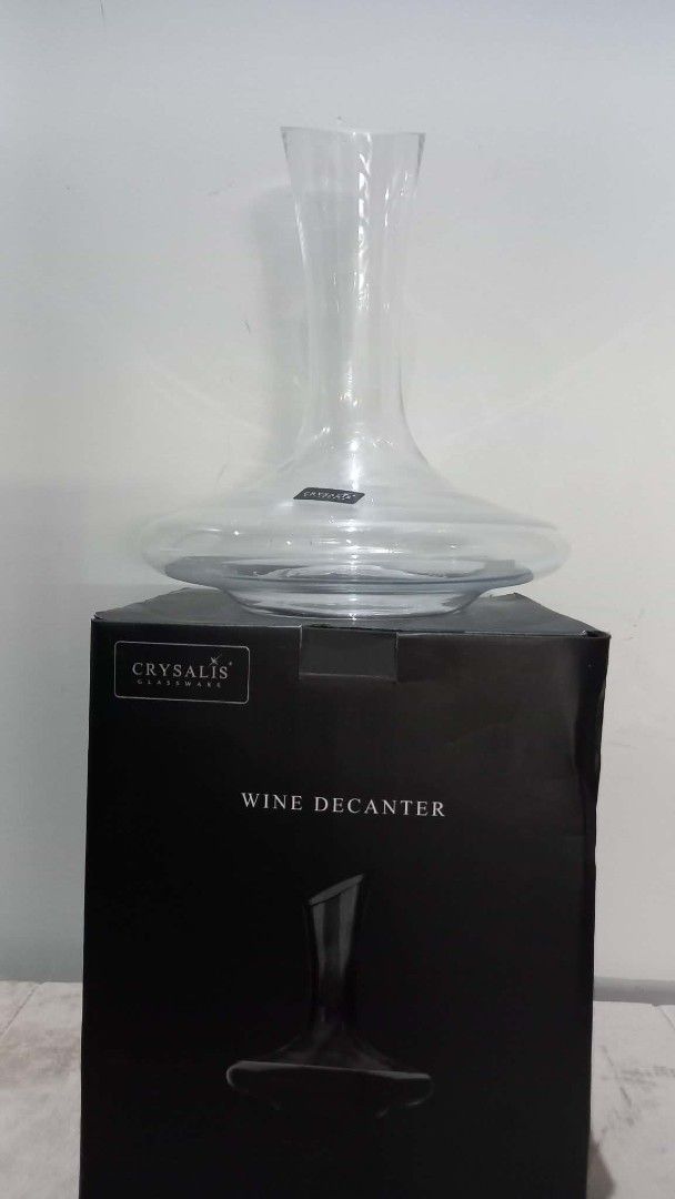 Crysalis Wine Decanter (Category: Other Kitchenware & Tableware) located in Cavite. Submitted by geturs (Listing ID 1434263908, Image 1). Description: - Crystalis wine decanter - Made of soda-lime glass - Features a wide base and pour spout - Designed to aerate wine for enhanced flavor and aroma - Comes in its original box - Ideal for home use or as a gift.