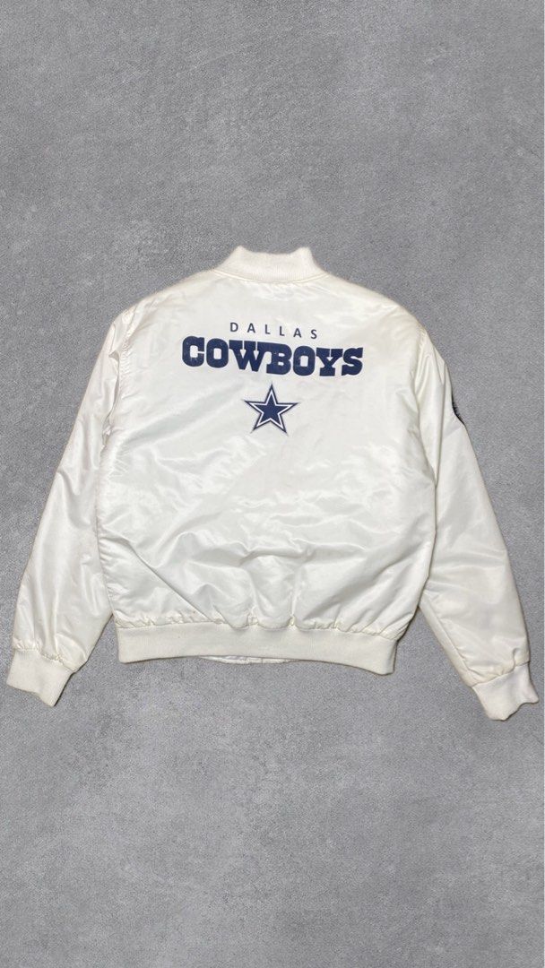 Dallas Cowboys Satin Bomber Jacket (Category: Coats, Jackets and Outerwear) located in Davao. Submitted by thebrandless_co (Listing ID 1434341276, Image 2). Description: - Dallas Cowboys satin bomber jacket - Features team logo on front and back - Quilted interior for warmth - Button-up closure - Ribbed collar, cuffs, and hem - NFL logo detail.
