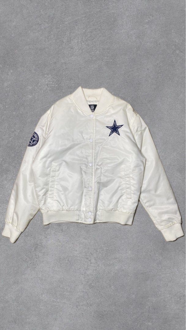 Dallas Cowboys Satin Bomber Jacket (Category: Coats, Jackets and Outerwear) located in Davao. Submitted by thebrandless_co (Listing ID 1434341276, Image 1). Description: - Dallas Cowboys satin bomber jacket - Features team logo on front and back - Quilted interior for warmth - Button-up closure - Ribbed collar, cuffs, and hem - NFL logo detail.