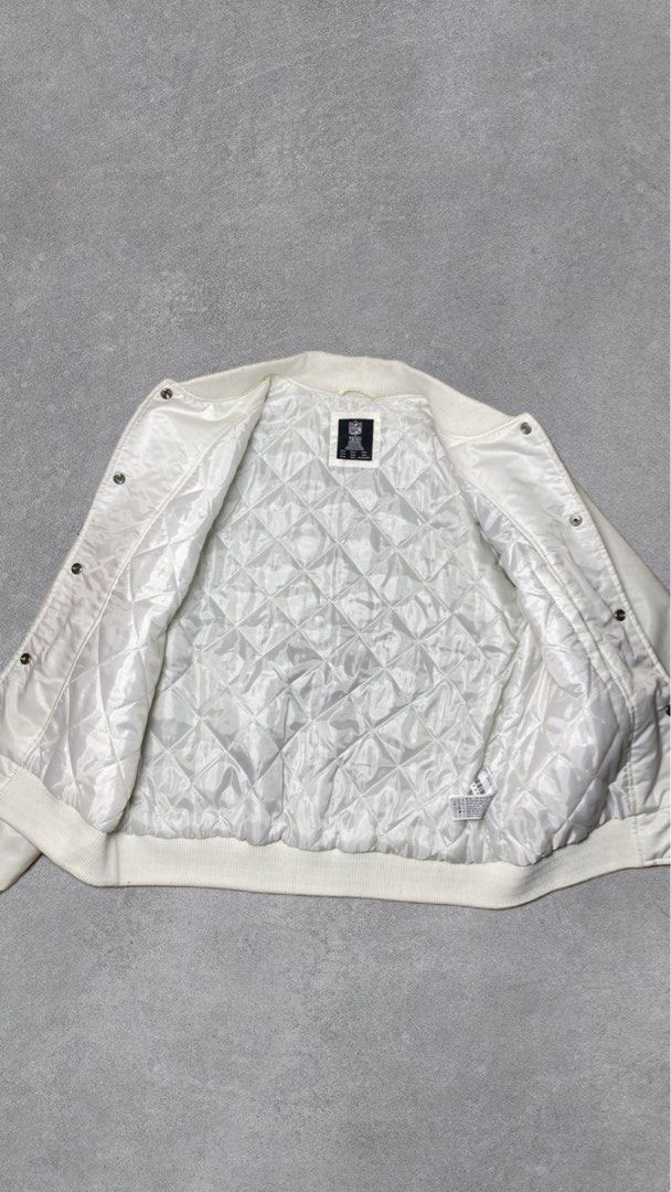 Dallas Cowboys Satin Bomber Jacket (Category: Coats, Jackets and Outerwear) located in Davao. Submitted by thebrandless_co (Listing ID 1434341276, Image 3). Description: - Dallas Cowboys satin bomber jacket - Features team logo on front and back - Quilted interior for warmth - Button-up closure - Ribbed collar, cuffs, and hem - NFL logo detail.