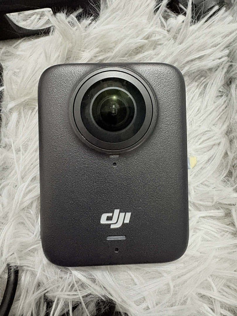 DJI Osmo Action 360 Camera (Category: Cameras) located in Las Pinas. Submitted by anythinganywearols (Listing ID 1434261554, Image 1). Description: - DJI Osmo 360 camera included - Comes with protective case, charging case, and Osmo case - Includes a selfie stick and charging cable - Camera features a front screen and lens - Black Osmo case with zipper - Black, extendable selfie stick all accessories included + 2 free bats rfs: need funds bought 