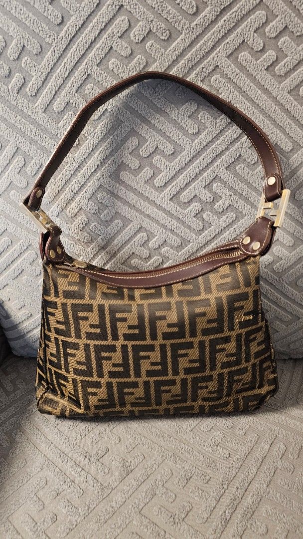 Fendi Shoulder Bag (Category: Luxury Bags & Wallets) located in Quezon City. Submitted by jollythrift (Listing ID 1434250333, Image 2). Description: Vintage Fendi Zucca shoulder bag Made in Italy, classic FF monogram canvas with leather trim Good vintage (late 80's to 90's era) condition – normal signs of use on corners and rubs on 2 parts Clean interior, all hardware working Perfect everyday designer bag / Y2K style Some sources indicate that it