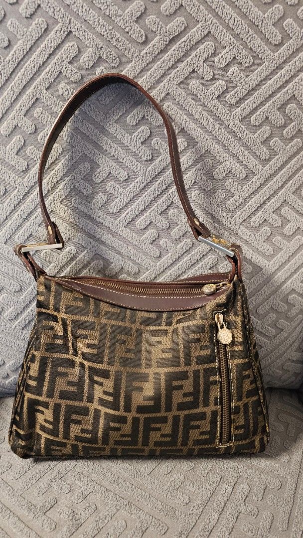 Fendi Shoulder Bag (Category: Luxury Bags & Wallets) located in Quezon City. Submitted by jollythrift (Listing ID 1434250333, Image 1). Description: Vintage Fendi Zucca shoulder bag Made in Italy, classic FF monogram canvas with leather trim Good vintage (late 80's to 90's era) condition – normal signs of use on corners and rubs on 2 parts Clean interior, all hardware working Perfect everyday designer bag / Y2K style Some sources indicate that it