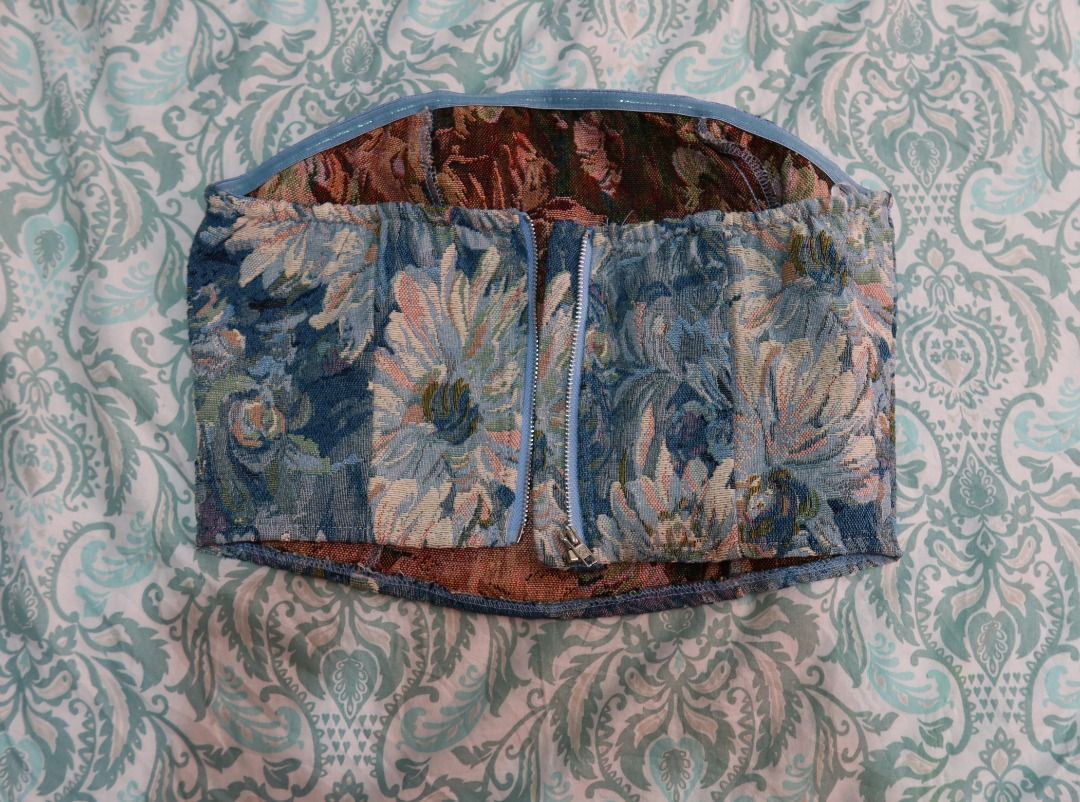 Floral Corset Tube Top (Category: Sleeveless) located in Manila. Submitted by lovedbydar (Listing ID 1434261649, Image 2). Description: - Floral corset top - Colors: Blue, green, and peach - Back zipper closure - Interior lining with floral pattern - Perfect for vintage-inspired looks.