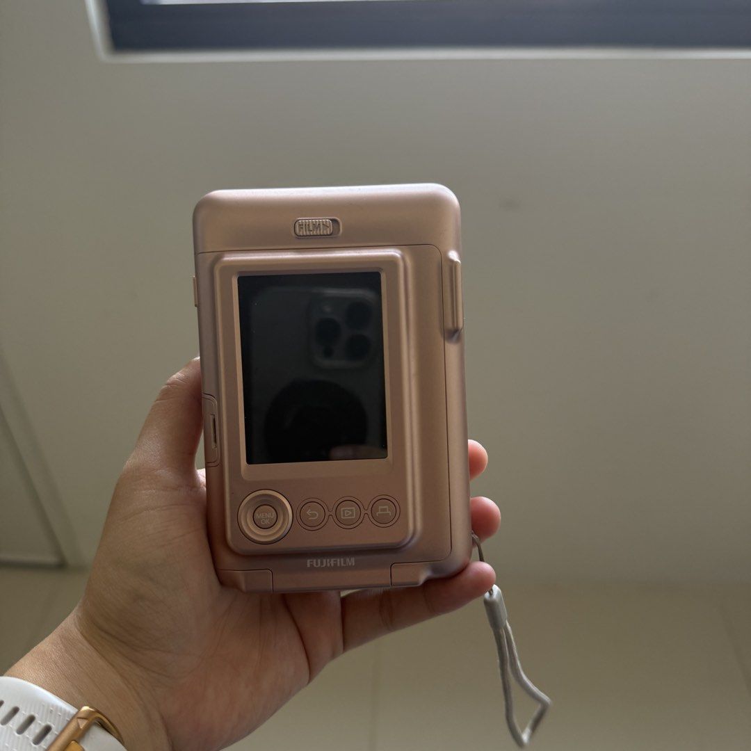 Fujifilm Instax Mini Liplay Rose Gold (Category: Cameras) located in Manila. Submitted by jannastuff (Listing ID 1434314464, Image 2). Description: Rose Gold Mini Liplay - Fujifilm Instax Camera Bought last 2019, honestly only used it for 5-8 times Camera Condition: No issues, used with lots of care, only has one scratch (check last photo) Comes with the complete box and charger The leather case shows some wear, but it has done a great job protec