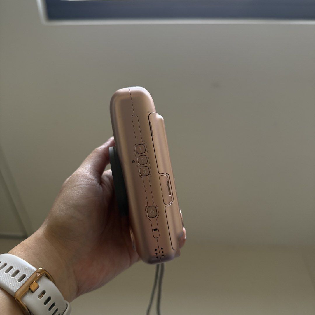 Fujifilm Instax Mini Liplay Rose Gold (Category: Cameras) located in Manila. Submitted by jannastuff (Listing ID 1434314464, Image 3). Description: Rose Gold Mini Liplay - Fujifilm Instax Camera Bought last 2019, honestly only used it for 5-8 times Camera Condition: No issues, used with lots of care, only has one scratch (check last photo) Comes with the complete box and charger The leather case shows some wear, but it has done a great job protec