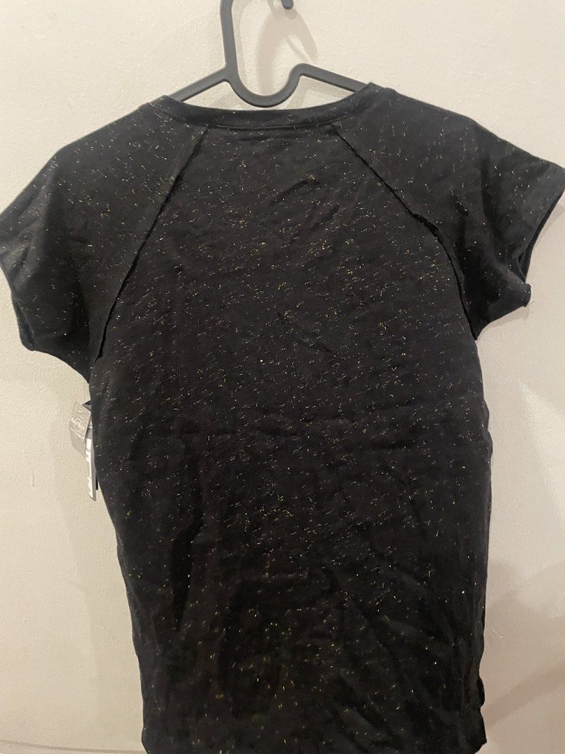 Hard Rock Cafe Dubai Ladies Tee XS (Category: Shirts) located in Shah Alam. Submitted by arliajuli54930 (Listing ID 1434279419, Image 3). Description: - Authentic Hard Rock Cafe Dubai Ladies Tee - Size: XS - Color: Black - Features a metallic gold logo - Material: 98% cotton, 2% lurex - Made in India - Original Price: AED 120.00 - Crew neck and short sleeves.