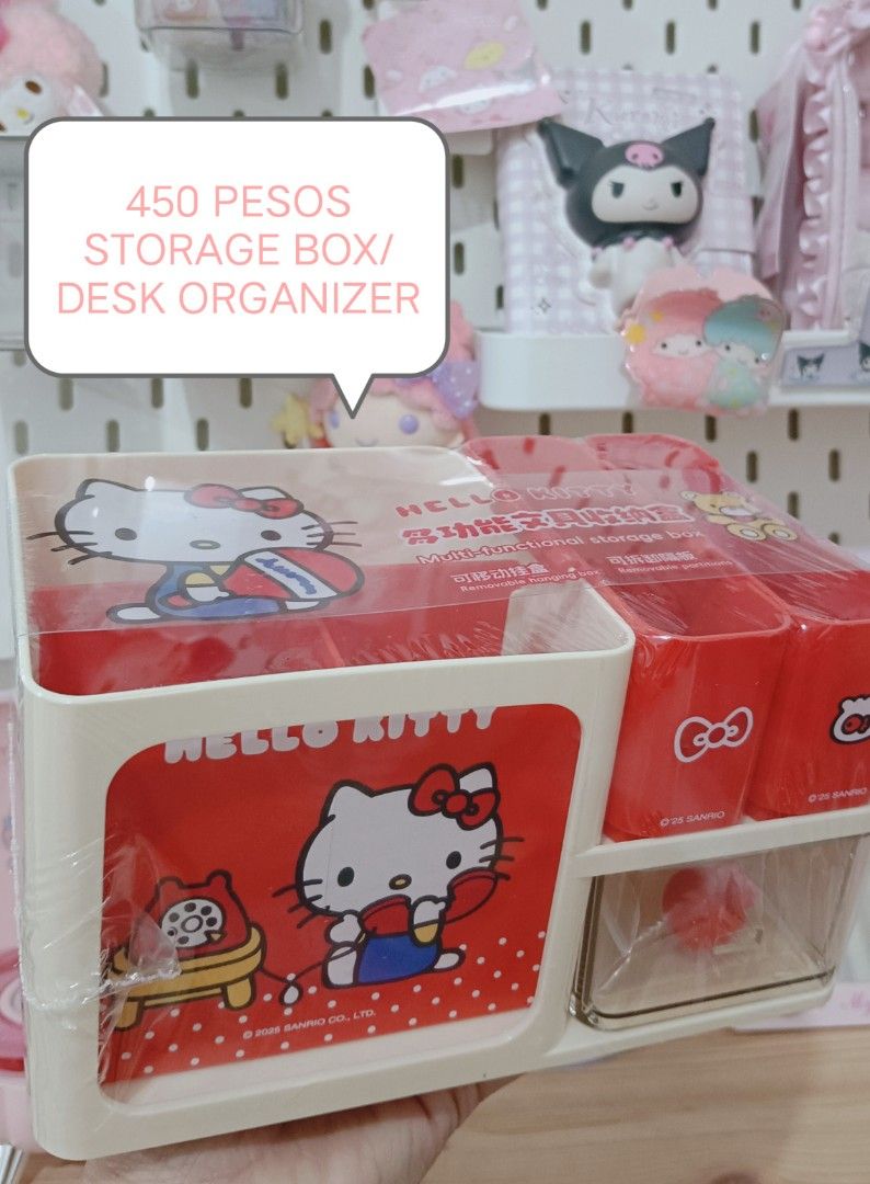 Hello Kitty Storage Box/Desk Organizer (Category: Storage Boxes & Baskets) located in Manila. Submitted by masterlei (Listing ID 1434266677, Image 1). Description: - Kitty desk organizer - Red and white design - Features Kitty graphics - Multiple compartments for storage - Includes a drawer - Keeps your desk organized - Adds a cute touch.