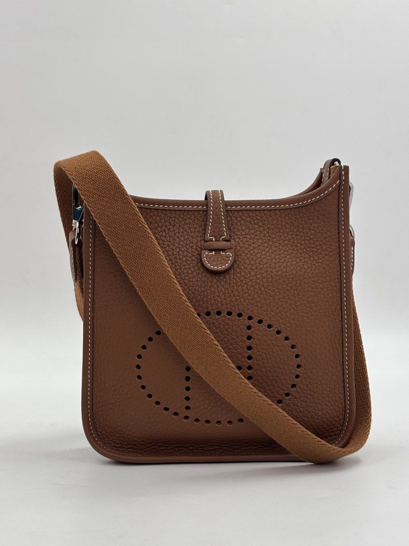 Hermes Evelyne TPM Gold (Category: Luxury Bags & Wallets) located in Manila. Submitted by patrickmaningas (Listing ID 1434330877, Image 1). Description: - Authentic Hermes Evelyne TPM - Crafted from rich brown leather - Features the signature perforated 'H' logo - Comfortable canvas shoulder strap - Secure snap closure - Palladium hardware - With Paperbag, Dustbag and Legit Grails.