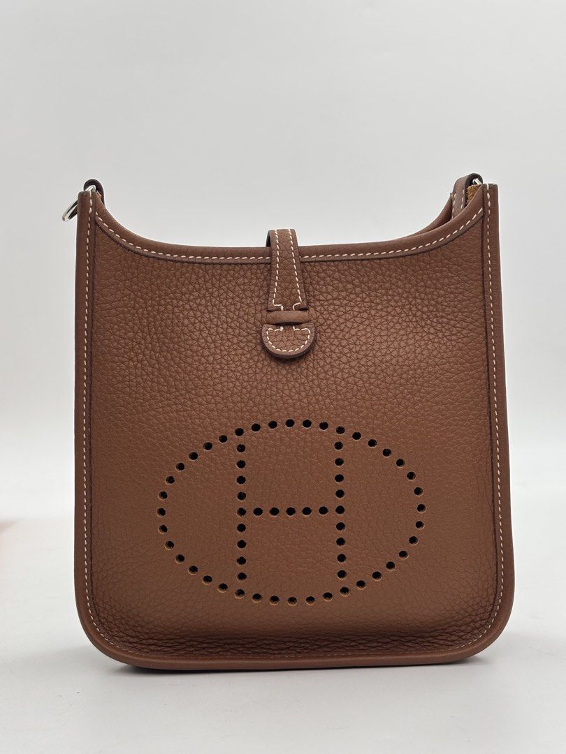 Hermes Evelyne TPM Gold (Category: Luxury Bags & Wallets) located in Manila. Submitted by patrickmaningas (Listing ID 1434330877, Image 2). Description: - Authentic Hermes Evelyne TPM - Crafted from rich brown leather - Features the signature perforated 'H' logo - Comfortable canvas shoulder strap - Secure snap closure - Palladium hardware - With Paperbag, Dustbag and Legit Grails.