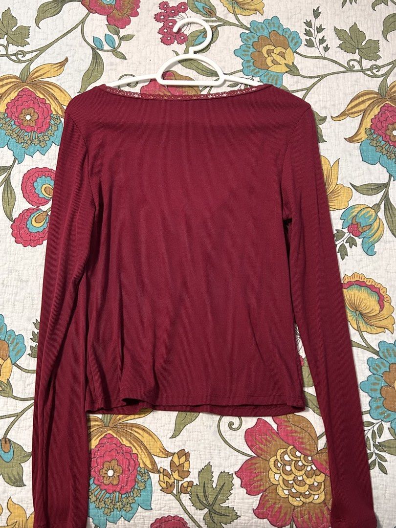 H&M Divided Burgundy Long Sleeve Top (Category: Longsleeves) located in Manila. Submitted by zxcvbnmsof (Listing ID 1434303816, Image 2). Description: - Divided burgundy long sleeve top - V-neckline with delicate lace trim - Ribbed texture .