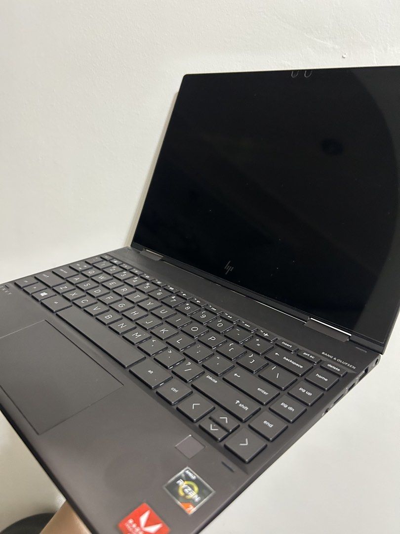 HP Envy x360 Convertible Laptop (Category: Laptops & Notebooks) located in Quezon City. Submitted by charlieee3_ (Listing ID 1434303199, Image 1). Description: HP Envy x360 convertible laptop with Bang & Olufsen speakers. Features an AMD Ryzen 7 processor and Radeon Vega Graphics. Includes multiple ports such as USB, SD card slot, and USB-C. The laptop has a sleek, dark gray finish and a full keyboard. - used for school only - 8GB RAM - with scre