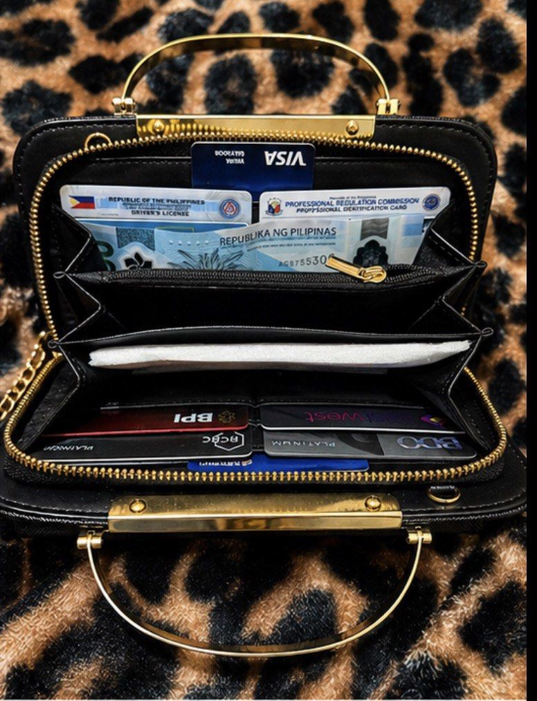 Isabelle Clutch Bag (Category: Luxury Bags & Wallets) located in Pagadian. Submitted by maximaxcollection (Listing ID 1434240268, Image 3). Description: ✨ Isabelle Elegant Clutch Wallet (Brand New!) ✨ Step out in style with this sleek black clutch featuring a luxurious gold handle and detachable chain strap 💫 ✔️ Brand: Isabelle ✔️ Condition: Brand New with Tags ✔️ Material: Vegan Leather 🌱 ✔️ Color: Classic Black with Gold Hardware ✔️ Includes: