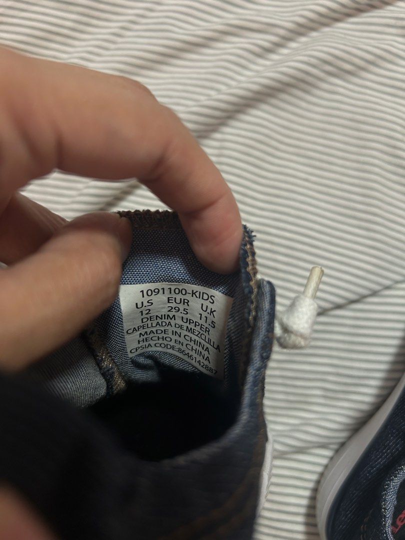 Levi's Denim Kids Shoes (Category: Babies & Kids Fashion) located in Manila. Submitted by treenitea (Listing ID 1434312235, Image 2). Description: - Levi's kids' denim shoes - Size: US 12, EUR 29.5, UK 11.5 - Dark blue denim upper - White laces - White toe cap - Material: Denim - Perfect for kids.