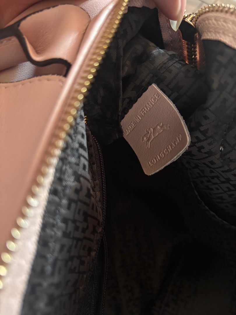 Longchamp Xtra S Handbag (Nude Pink) (Category: Luxury Bags & Wallets) located in Rizal. Submitted by sstuffsbyme (Listing ID 1434240420, Image 2). Description: Authentic Le Pliage Handbag in Nude See pics for the minor issues (exterior) (press marks are very minor; due to shipment. the bottom part is due to signs of use; 4x used) Zipper is still okay With original strap RFS: declutter.