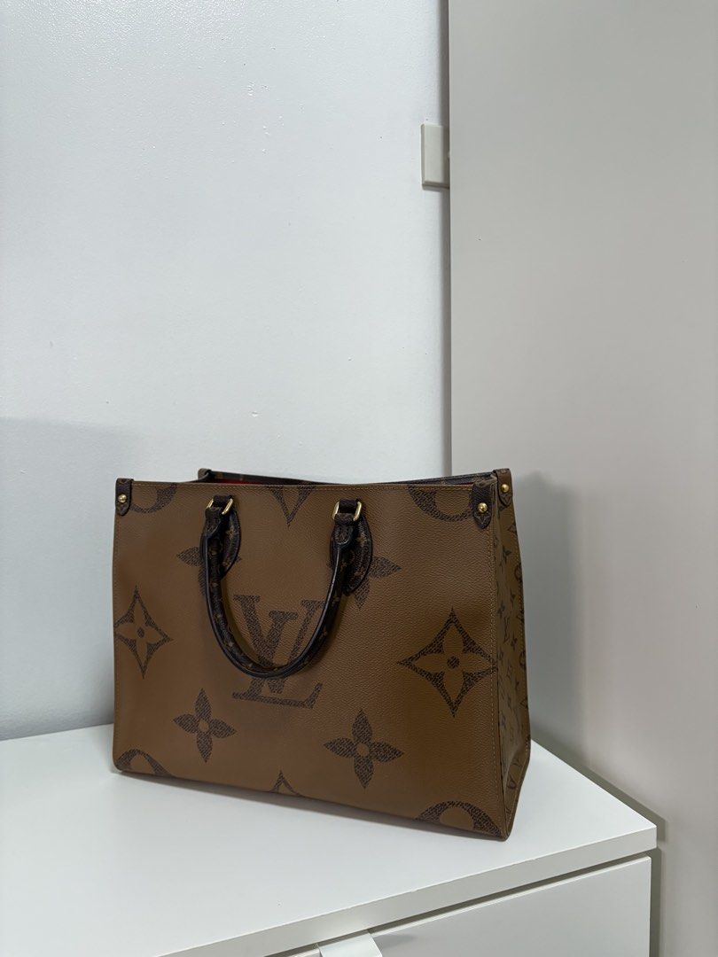 Louis Vuitton OnTheGo PM Tote Bag (Category: Luxury Bags & Wallets) located in Taguig. Submitted by nejj00 (Listing ID 1434256257, Image 2). Description: - Authentic Louis Vuitton OnTheGo PM tote bag - Iconic monogram pattern - Spacious interior with red lining - Black leather handles - Gold-tone hardware - Structured design - Ideal for everyday use.