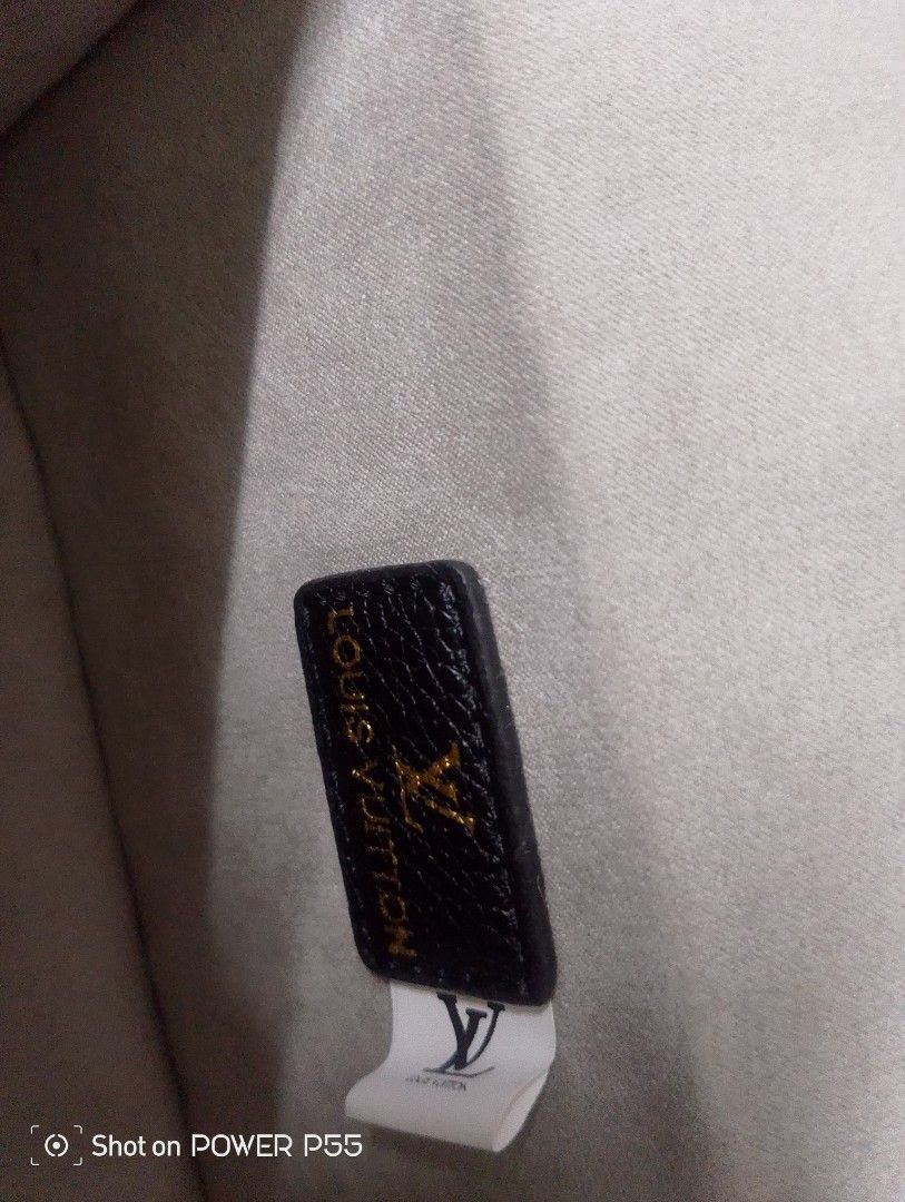 Louis Vuitton White Embossed Crossbody Bag (Category: Cross-body Bags) located in Binan City. Submitted by stuffshop29 (Listing ID 1434237489, Image 3). Description: - Louis Vuitton Crossbody Bag - Embossed pattern - Color: White - Dimensions: 19*11*5 - Buckle closure - Detachable strap - Includes original box and dust bag - Interior: Black leather tag with Louis Vuitton logo.