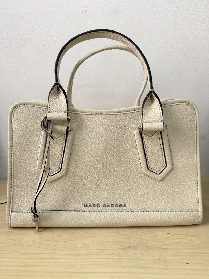 Marc Jacobs Drifter Satchel Bag (Category: Luxury Bags & Wallets) located in Quezon City. Submitted by sashiimii1720 (Listing ID 1434288300, Image 1). Description: - Cream-colored Marc Jacobs satchel bag - Top handle and detachable shoulder strap - Multiple interior compartments - Includes care card - Material: 100% cow split leather with polyurethane coating - Used a few times.
