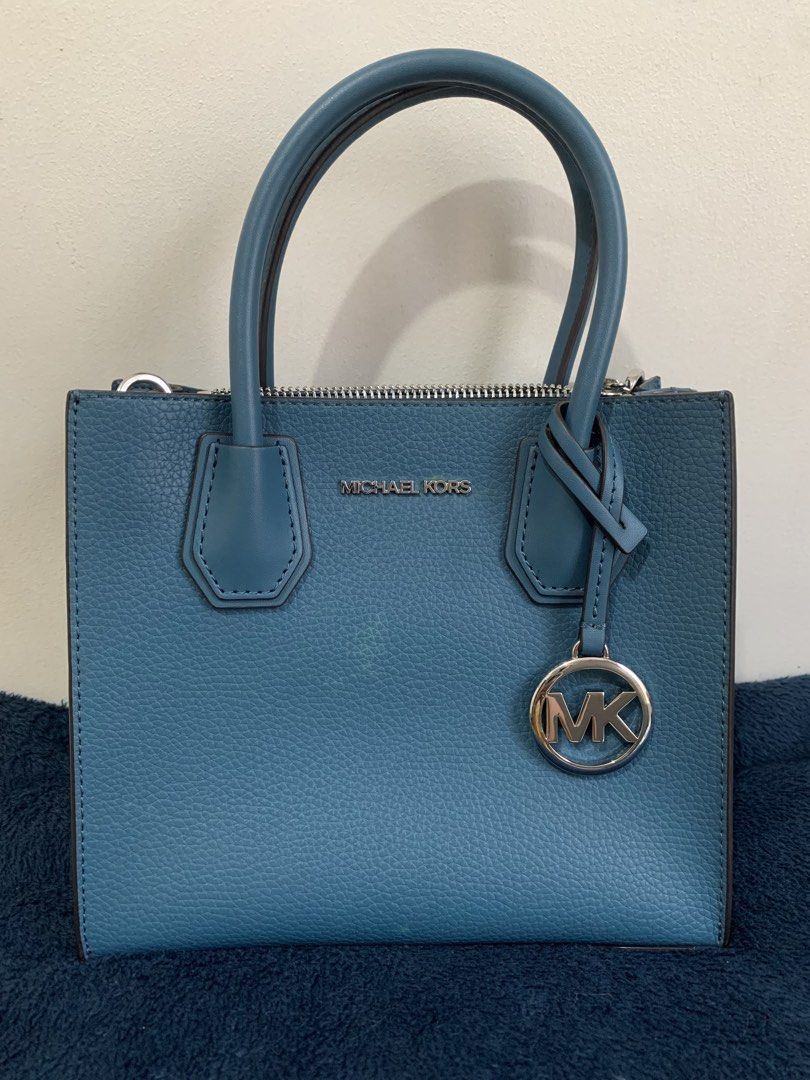 Michael Kors Mercer Small Top-Handle Bag (Category: Luxury Bags & Wallets) located in Paranaque City. Submitted by yammmyh (Listing ID 1434203080, Image 2). Description: - Michael Kors Mercer bag - Color: Blue - Hardware: Silver-tone - Features: Top handle, detachable shoulder strap - Closure: Zip - Interior: Zip pocket - Includes metal logo charm - Original price tag included ($448) - used only once.
