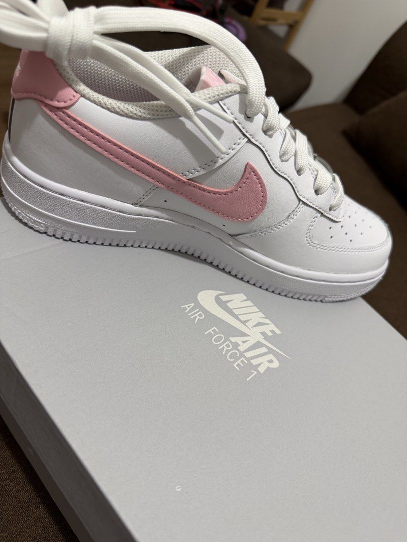 Nike Air Force 1 White Pink (Category: Sneakers) located in Makati City. Submitted by sunsetk (Listing ID 1434236818, Image 1). Description: - Nike Air Force 1 sneakers - 23.5 cm / EU 37 / US 6 / UK 4.5 - White with pink accents - Iconic pink Nike swoosh - Includes original box - White laces - White sole - Unworn condition Makati pick up or delivery.
