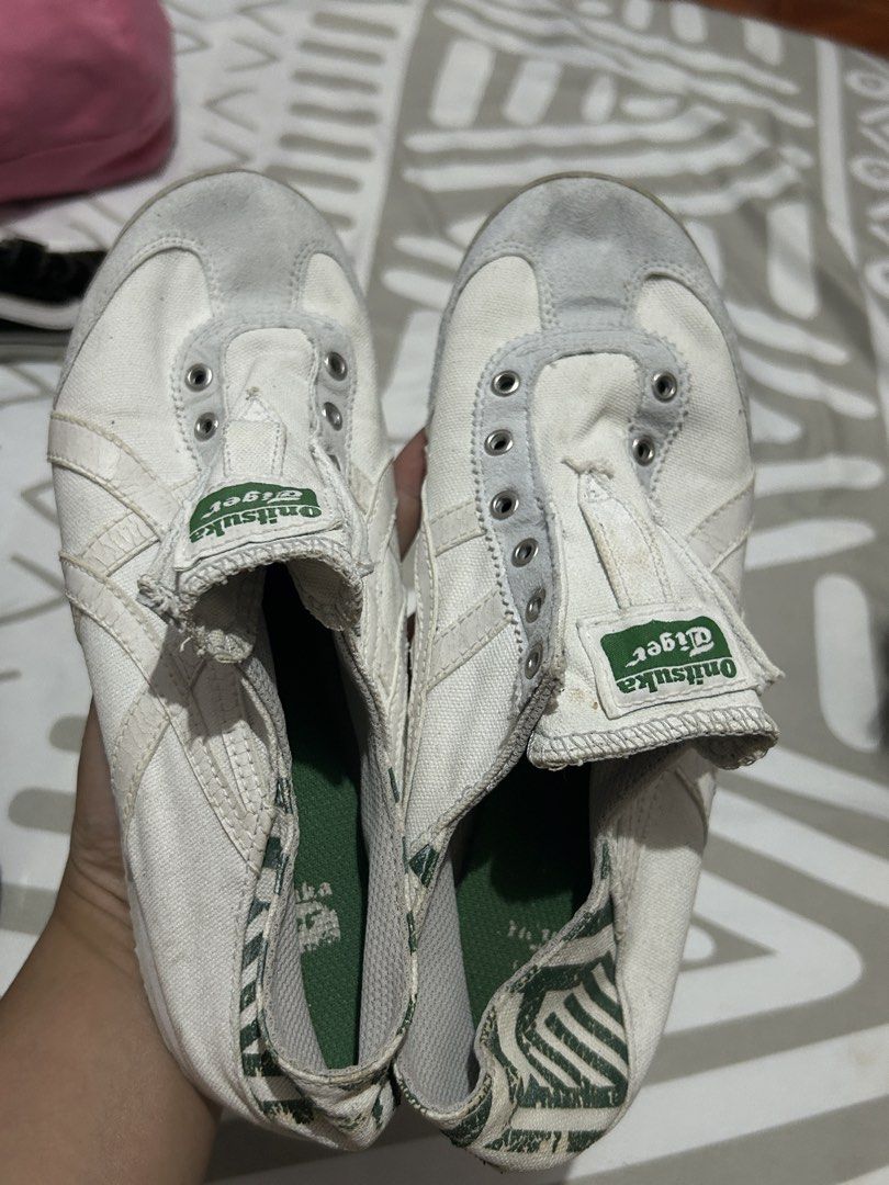 Onitsuka Tiger Mexico 66 White Sneakers (Category: Sneakers) located in Leyte. Submitted by justjpia (Listing ID 1434323508, Image 1). Description: - Onitsuka Tiger Mexico 66 sneakers - Color: White - Features iconic tiger stripes - Green and white patterned heel - Signs of wear: creasing on upper, wear on soles - Missing laces - Green and white striped insoles.
