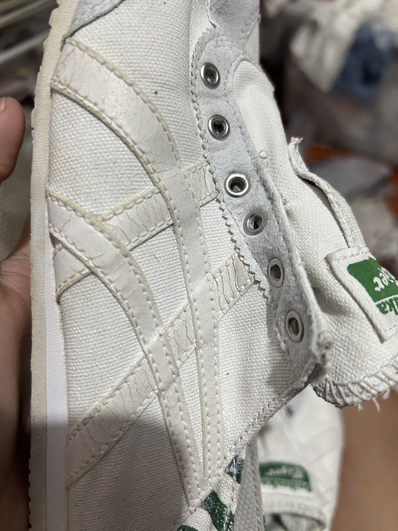 Onitsuka Tiger Mexico 66 White Sneakers (Category: Sneakers) located in Leyte. Submitted by justjpia (Listing ID 1434323508, Image 2). Description: - Onitsuka Tiger Mexico 66 sneakers - Color: White - Features iconic tiger stripes - Green and white patterned heel - Signs of wear: creasing on upper, wear on soles - Missing laces - Green and white striped insoles.