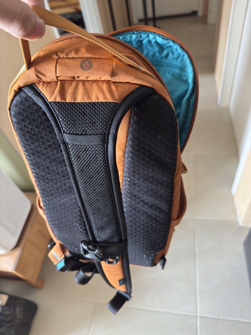 Pacsafe 12L Sling Backpack (Category: Backpacks) located in Pasay City. Submitted by leo665555 (Listing ID 1434240874, Image 3). Description: - Pacsafe 12L Sling Backpack - Anti-theft features: lockable zippers, slash-resistant material - 3-point carry system, ambidextrous - 12L capacity - 11 inches wide - Color: Orange exterior, Blue interior - Padded back for comfort.