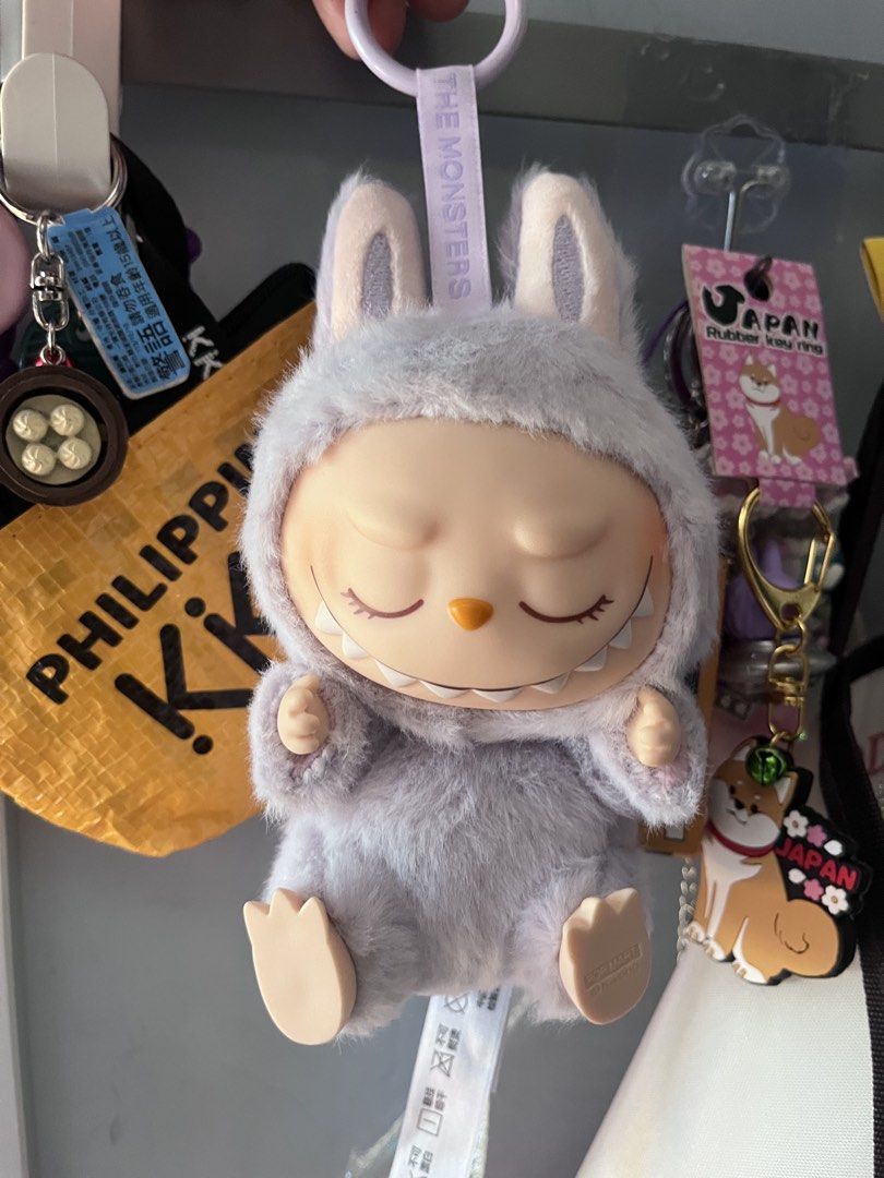 Pop Mart The Monsters Labubu Keychain (Category: Designer & Blind Box Toys) located in Cainta. Submitted by llsamson2000 (Listing ID 1434183519, Image 1). Description: - Pop Mart The Monsters Labubu keychain - Features a cute Labubu character in a bunny suit - Includes a keychain ring for easy attachment - Made with soft, huggable plush material - Ideal for collectors and cute accessory lovers.