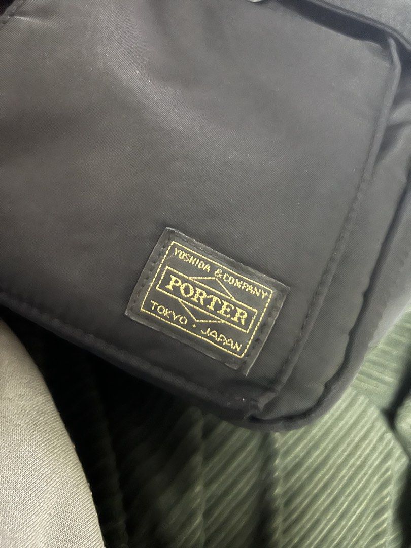Porter Yoshida & Co. Shoulder Bag (Category: Luxury Bags & Wallets) located in Manila. Submitted by mark_decluttering (Listing ID 1434215986, Image 2). Description: - Authentic Porter Yoshida & Co. shoulder bag - Classic black color - Multiple compartments for organization - Two front pockets - Interior with clear pockets and orange lining - Secure zipper closure - Includes Porter tag - Made in Japan Last price posted.