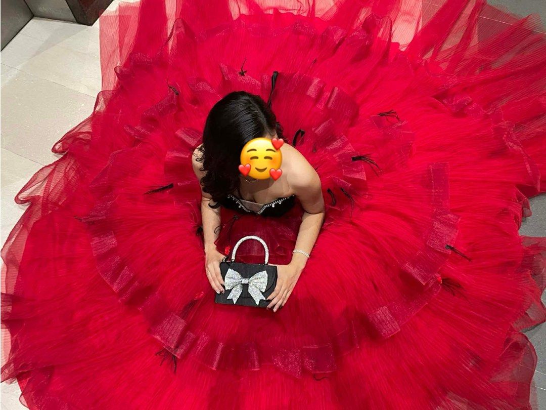 Red Ball Gown with Black Bodice (Category: Evening dresses & gowns) located in General Trias. Submitted by jd_15 (Listing ID 1434216312, Image 3). Description: Spent 45k for the gown - Elegant red ball gown - Strapless black bodice - Voluminous, layered tulle skirt - Includes a small black handbag with bow detail - Unique black accent design on the back.