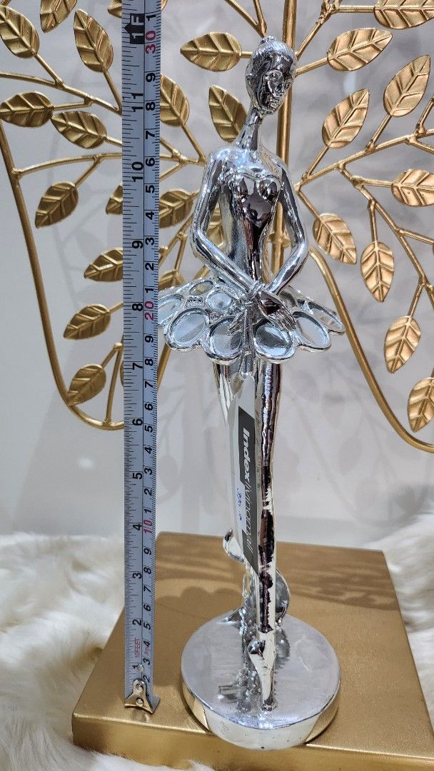 Silver Ballerina Figurine with Gold Base (Category: Figurines & Statues) located in Cavite. Submitted by geturs (Listing ID 1434260920, Image 2). Description: - Silver ballerina figurine - Clear glass-like element on base - Approximately 20cm long.