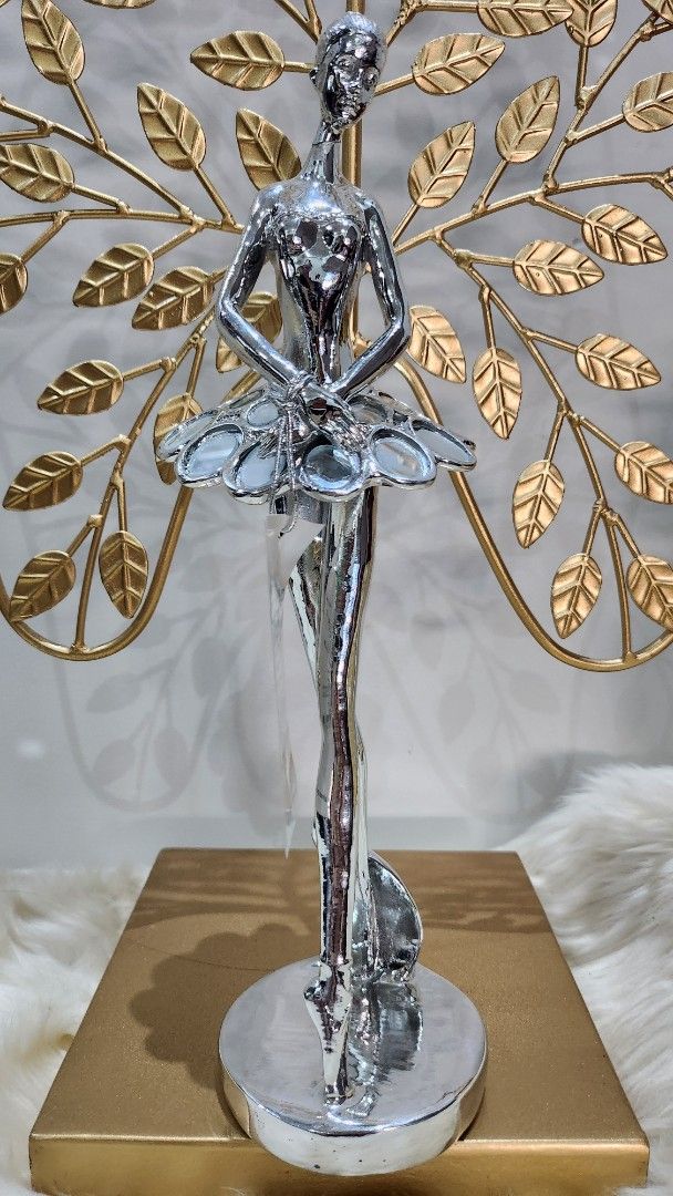 Silver Ballerina Figurine with Gold Base (Category: Figurines & Statues) located in Cavite. Submitted by geturs (Listing ID 1434260920, Image 3). Description: - Silver ballerina figurine - Clear glass-like element on base - Approximately 20cm long.
