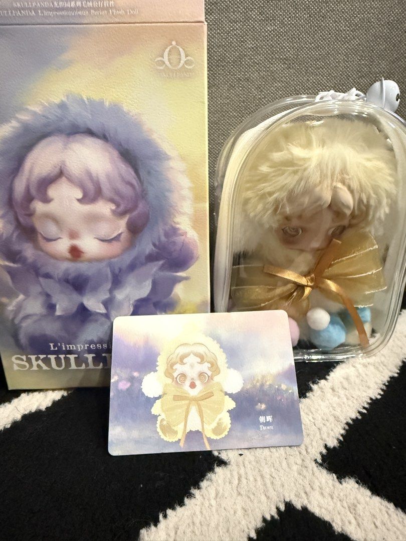 Skullpanda Impressionism Dawn Plush Doll (Category: Plushies & Soft Toys) located in Quezon City. Submitted by stuffamania (Listing ID 1434255163, Image 1). Description: - Skullpanda Impressionism Dawn plush doll - Includes original box (open top na) and collectible card - Protected in a plastic protective clear case - Features a fluffy, light-colored fur hood - Matching outfit with a bow - Unique artistic design -with pop mart paperbag -like new
