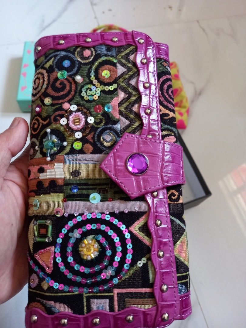 Think Bee! Embroidered Wallet (Category: Luxury Bags & Wallets) located in Tuguegarao City. Submitted by zenphoenix-7ad615 (Listing ID 1434245689, Image 3). Description: - Authentic Think Bee! wallet - Intricate embroidered design with sequins - Vibrant color palette - Purple crocodile-style leather trim and clasp - Multiple interior compartments - Yellow lining with heart pattern - Includes original box, dust bag, and tags.