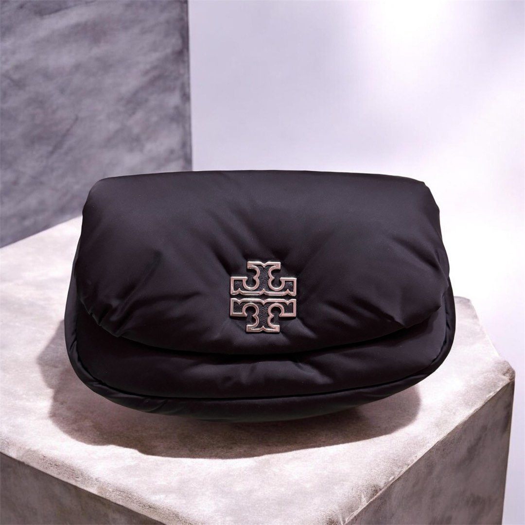 Tory Burch Puffer Nylon Crossbody (Category: Luxury Bags & Wallets) located in Caloocan City. Submitted by breelovedbags (Listing ID 1434303191, Image 1). Description: - Tory Burch Puffer Nylon Crossbody Bag - Britten Nylon Puffy Convertible model - Black color - Features the iconic Tory Burch logo - Stylish and versatile design - Perfect for everyday use Used twice or thrice only. Minor flaw (Small stain barely noticeable) Super nice in actual a