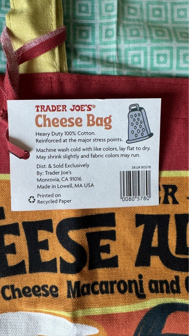 Trader Joe's Cheese Experience Tote Bag (Category: Tote Bags) located in Binan City. Submitted by nice_box (Listing ID 1434197387, Image 2). Description: - Trader Joe's "Cheese Experience" tote bag - Made of heavy-duty 100% cotton - Reinforced at stress points - Machine washable - Dimensions: Approximately 14 inches (H) x 19 inches (W) - Features yellow handles and a red body with cheese-themed graphics.