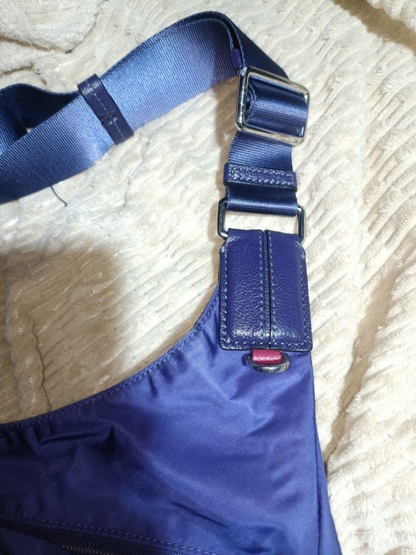 Tumi Carson voyageur Shoulder Bag (Category: Luxury Bags & Wallets) located in Manila. Submitted by coolfish_6a61f5 (Listing ID 1434331784, Image 3). Description: - Authentic Tumi shoulder bag - Eye-catching purple color - Adjustable strap for comfortable wear - Multiple compartments for organization - Main zippered section for security - Exterior pockets for easy access - Stylish light pink interior lining - Includes genuine Tumi leather tag - F