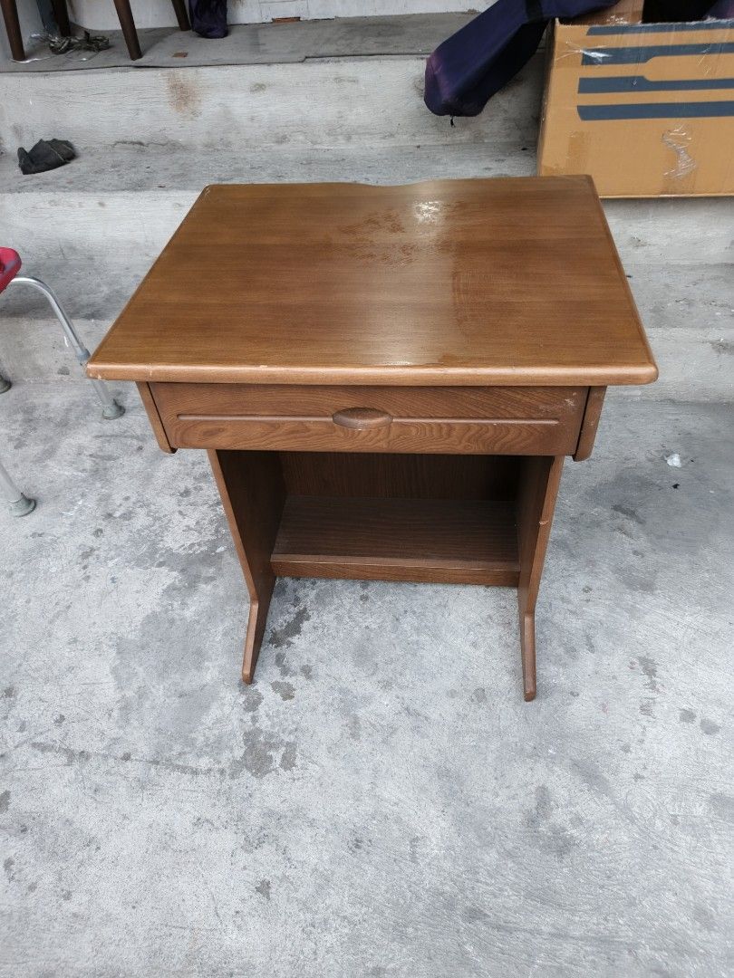 Wooden Side Table with Drawer (Category: Tables & Sets) located in Valenzuela. Submitted by kendra071914 (Listing ID 1434329846, Image 2). Description: - Wooden side table - Features a drawer and lower shelf - Warm brown finish - Dimensions: H-71cm, L-60cm, W-50cm - Perfect for bedside or small desk use - Classic aesthetic and practical storage.