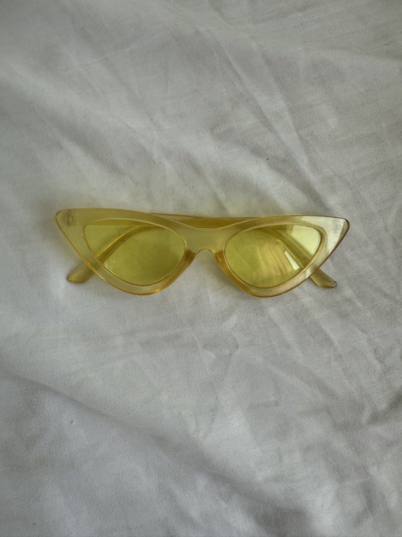 Yellow Cat-Eye Sunglasses (Category: Sunglasses & Eyewear) located in Manila. Submitted by cstdjyc (Listing ID 1434183546, Image 1). Description: - Stylish cat-eye design - Vibrant yellow tint - Matching yellow frames - Perfect for adding color to your outfit.