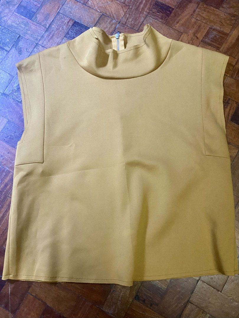 Zara Mustard Top (Category: Blouses) located in Makati City. Submitted by sweetsj (Listing ID 1434252380, Image 1). Description: - Zara mustard top - High neckline - Zipper closure at the back - Sleeveless - Boxy silhouette - Size M .