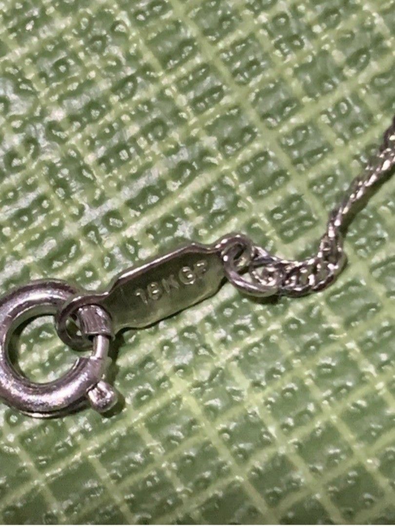 18k GP Necklace with Green Pendant (Category: Necklaces) located in Bulacan. Submitted by rafaesarisari (Listing ID 1434389668, Image 2). Description: - sterling silver necklace with a delicate chain. - Features a small, round, white pearl. - Adorned with a green flower pendant. - Suitable for everyday wear or special events. - A beautiful piece of jewelry..