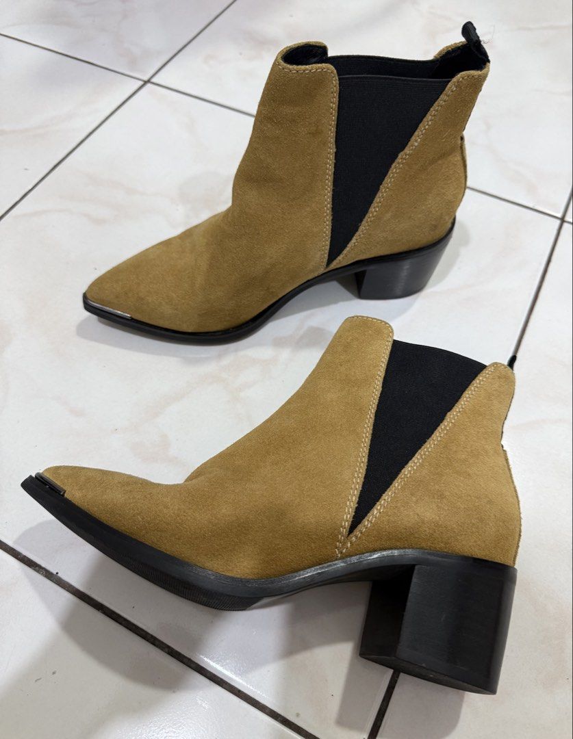 Acne Studios Pointed Toe Suede Ankle Boots (Category: Boots) located in Makati City. Submitted by bibas.corner (Listing ID 1434554016, Image 1). Description: - Acne Studios ankle boots - Tan suede - Size 37 - Made in Italy - Pointed toe with metal detailing - Elastic side panels - Block heel - Leather upper - Man-made sole.