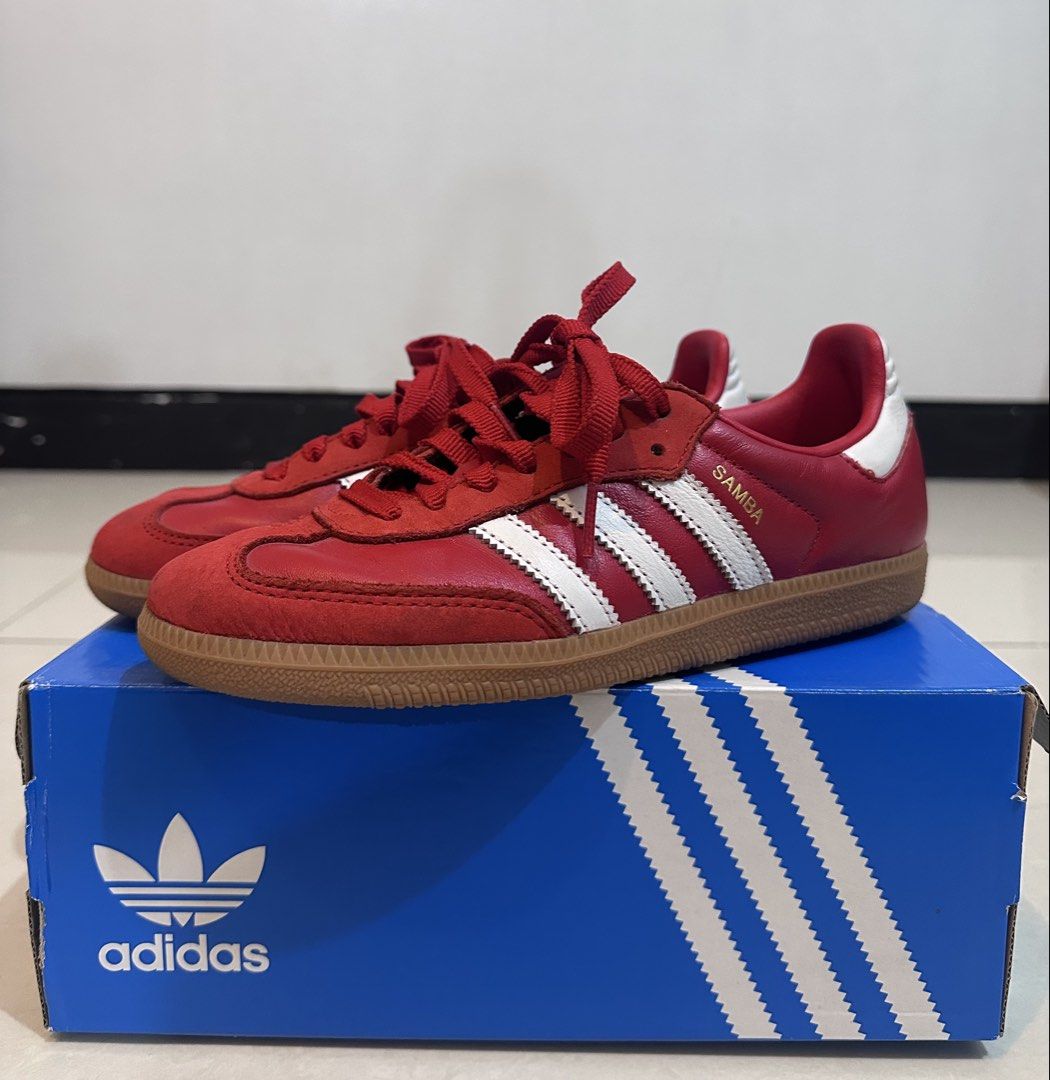 Adidas Samba OG W Red Sneakers (Category: Sneakers) located in Quezon City. Submitted by letayuuu (Listing ID 1434528506, Image 1). Description: - Adidas Samba OG W sneakers - Color: Red with white stripes - Size: US 5.5 / UK 4 / FR 36 2/3 / JP 225 - Features: Gum sole, red laces - Includes original box.