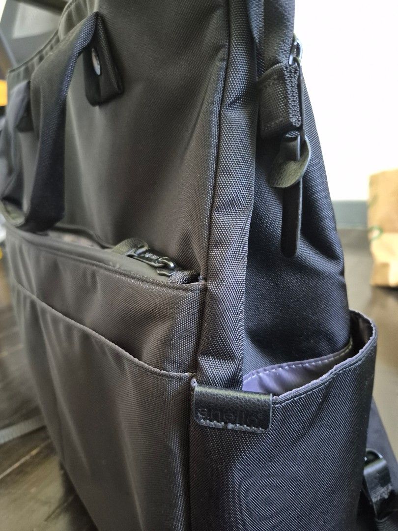 Anello 3-Way Bag (Category: Shoulder Bags) located in Valenzuela. Submitted by pappx (Listing ID 1434439844, Image 3). Description: - Anello 3 way bag - Sleek black design - Multiple compartments and pockets for organization - Top handle and detachable shoulder strap - Water-resistant material - Fits a 13-inch laptop - Zipper closure - 10 pockets.