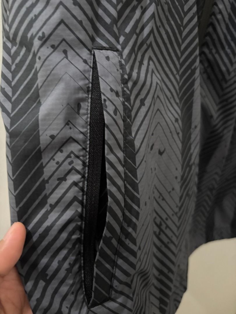 Anta Klay Thompson Jacket (Category: Activewear) located in Manila. Submitted by aboutsammy (Listing ID 1434422389, Image 2). Description: - Anta Klay Thompson Jacket - Stylish gray and black pattern - Lightweight material - Features a hood and pockets - Klay Thompson branding on the back - Size 2XL - In pristine condition Perfect for running, rainy weather top up. RFS: Unused, decluttering lang po. DM for last price offer. .