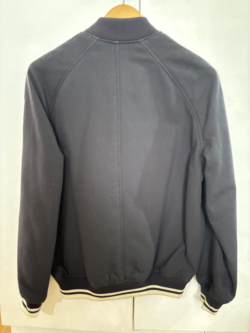 A.P.C. Navy Bomber Jacket - Size M (Category: Coats, Jackets and Outerwear) located in Marikina City. Submitted by surity99 (Listing ID 1434416679, Image 2). Description: - A.P.C. Navy Bomber Jacket - Size: M - Features: - Ribbed collar, cuffs, and hem with white stripes - Button-up front - Two front pockets - Lined with silky material - Made in China Pit to pit 21 in Length 27 in Raglan Sleeves 28 in.