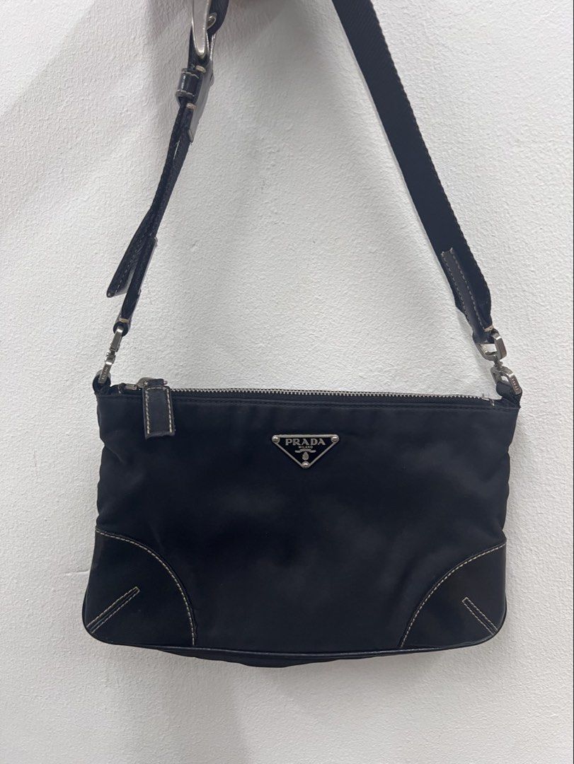 Authentic Prada Tessuto Nylon Baguette Bag (Category: Luxury Bags & Wallets) located in Cagayan de Oro. Submitted by riggstuffs (Listing ID 1434461440, Image 1). Description: ➡️ Guaranteed Authentic Prada Tessuto Baguette bag ➡️ With white tag ➡️ Made in Italy ➡️ Nylon material with leather trimmings ➡️ Minimal signs of use at the interior material ➡️ no other inclusion ➡️ Dimension: H6”x W 9”, sling drop 6” Disclaimer : Riggstuffs is not associa