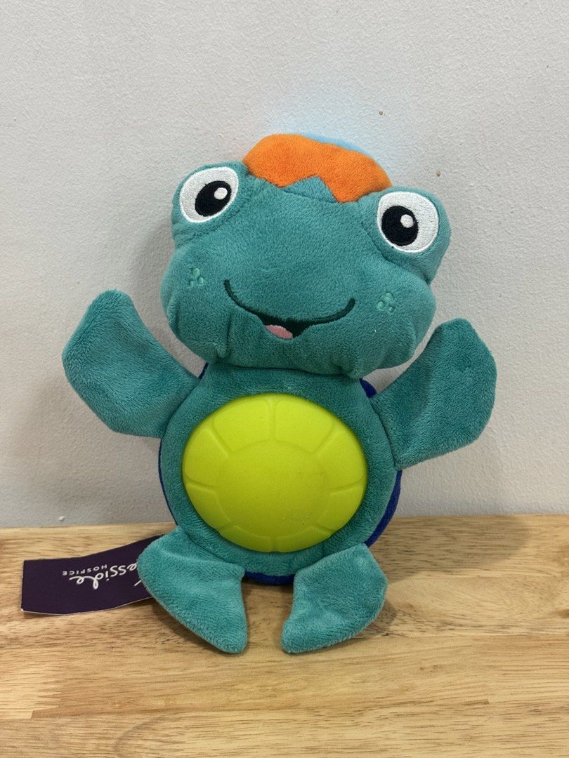 Baby Einstein "Glow to Sleep" Neptune Turtle (Category: Infant Playtime) located in Binan City. Submitted by thelittleloop (Listing ID 1434509635, Image 1). Description: With its soft and cuddly texture, it’s perfect for snuggling up with during nap time. The toy also features a unique singing and flashing light show that’s sure to delight and entertain. Crafted with high-quality materials and attention to detail, this musical toy is designed to 