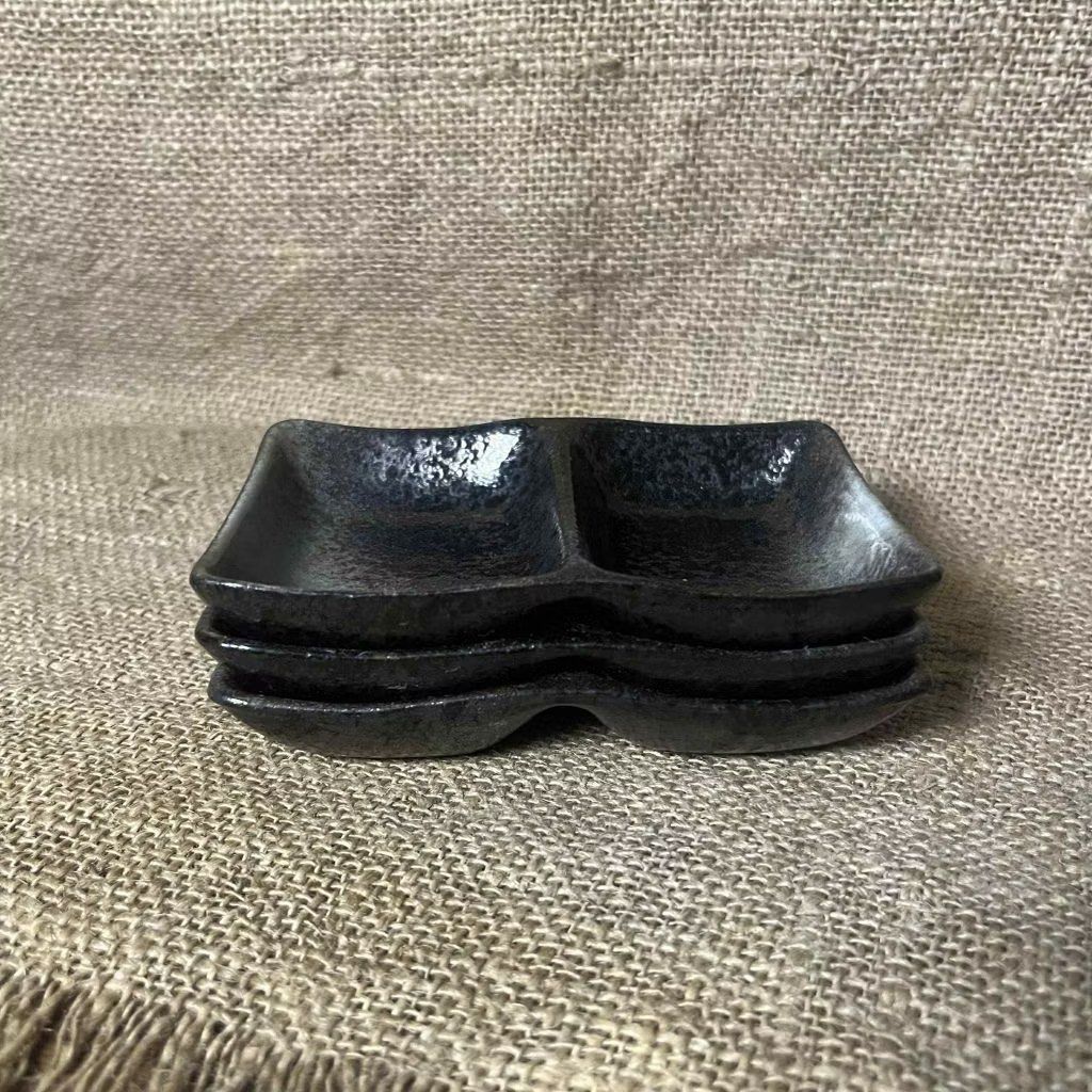 Black Ceramic Dual Compartment Dipping Dish (Category: Other Kitchenware & Tableware) located in Bulacan. Submitted by ceramicscubby (Listing ID 1434502582, Image 2). Description: Size: 5 L x 3.5 W in. ❗️CLOSING DOWN SALE, ALL PRICES ARE MARKED DOWN. WE WILL NOT BE ACCEPTING OFFERS LOWER THAN OUR ASKING PRICE. ❗️ - Set of black ceramic double dipping dishes - Each dish has two compartments - Ideal for sauces, dips, or snacks - Unique textured fin
